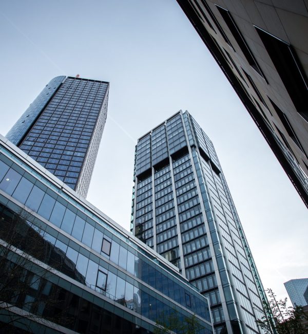 A low angle shot of high rise buildings under the clear sky in Frankfurt, Germany